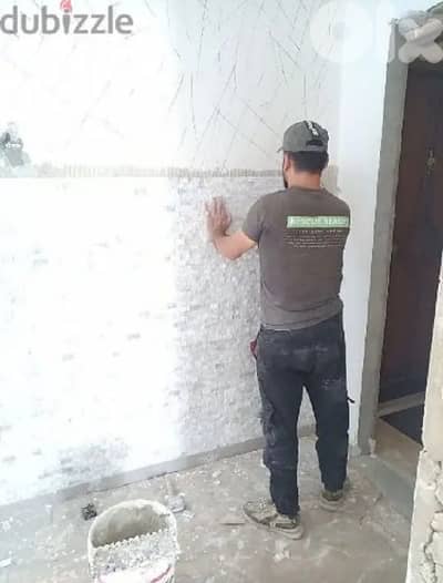 معلم بلاط وحجر ومجالي