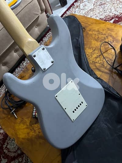 Light blue electric guitar with amp,cable,strap,and picks full bundle