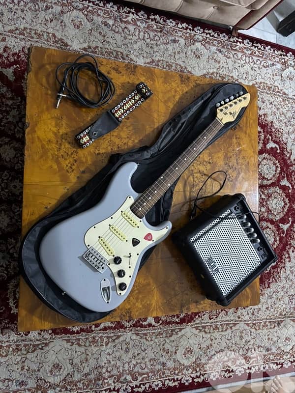 Light blue electric guitar with amp,cable,strap,and picks full bundle 1