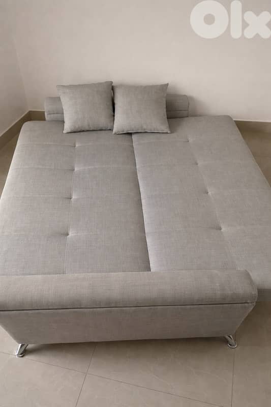Grey Sofa  Bed with two pillows 1