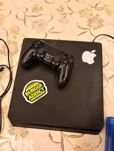 ps4 slim + charger and cds setup