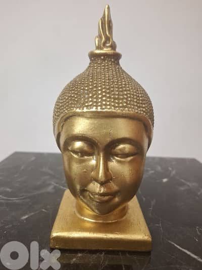 راس بوذا ذهبي