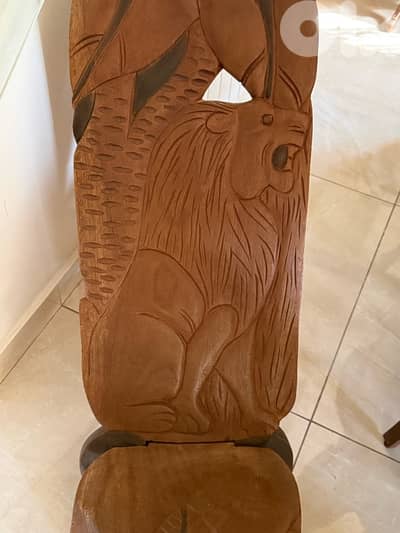 wood chair with lion design imported from Africa