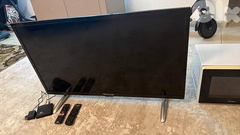 microwave , tv and water cooler 1