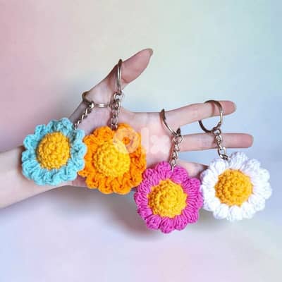 Handmade crochet daisy flower keychain in white blue pink and orange