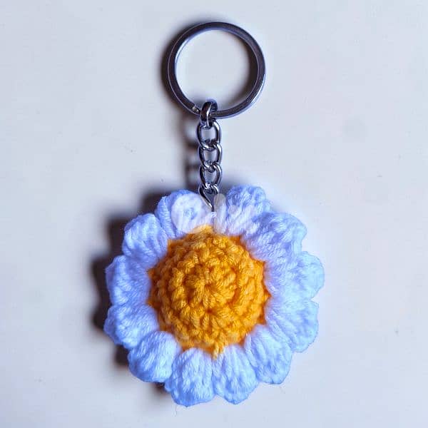 Handmade crochet daisy flower keychain in white blue pink and orange 1