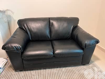 Black faux leather couch