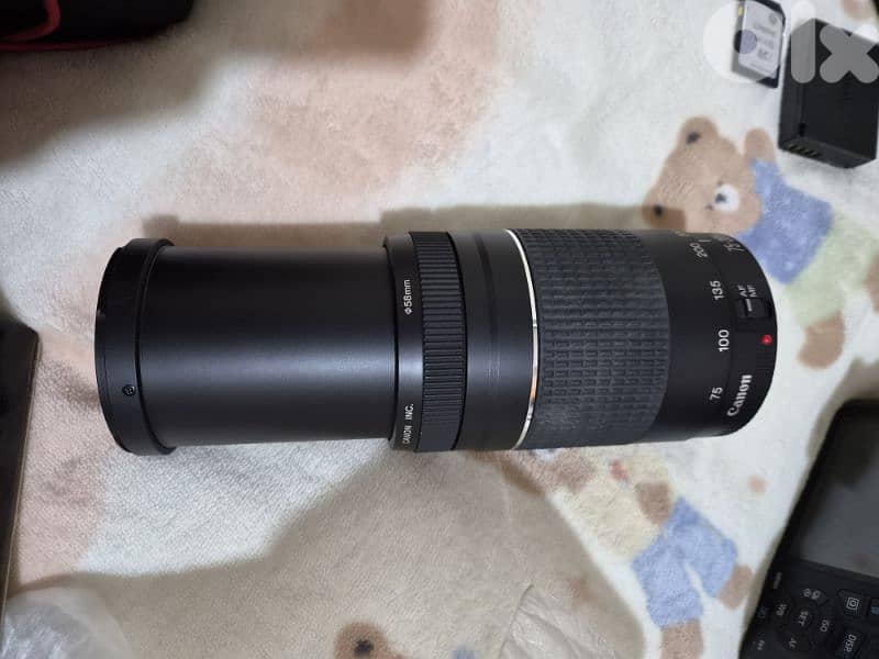 canon Eos 1300d with the lens + another lens canon 75-300mm 3