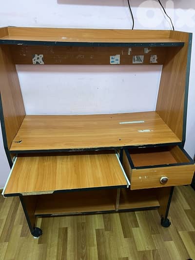 Desk with chair that has wheels