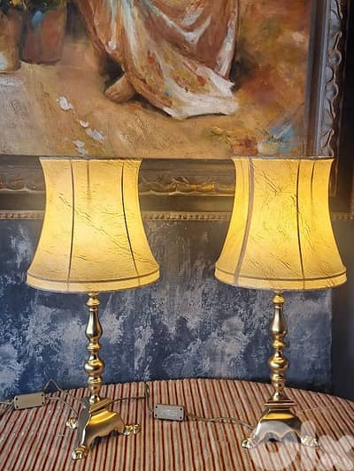 2 antique brass and leather lamps