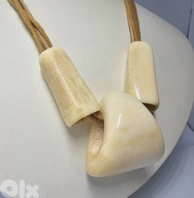 40$ bohemian-style necklace features large bone or horn pendants