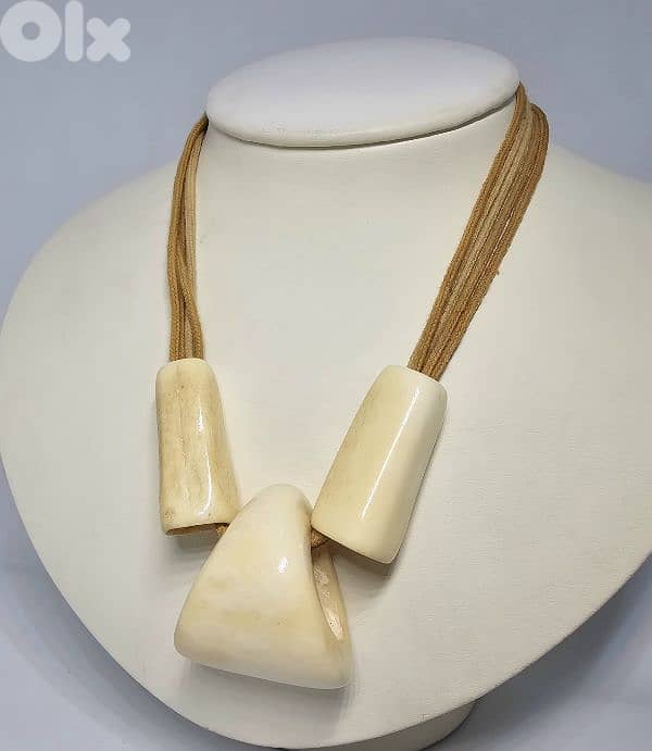 40$ bohemian-style necklace features large bone or horn pendants 1