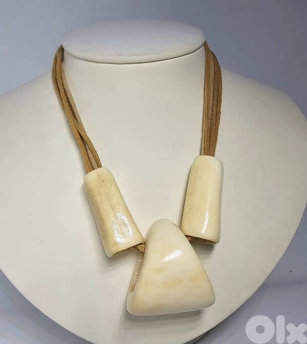 40$ bohemian-style necklace features large bone or horn pendants 3