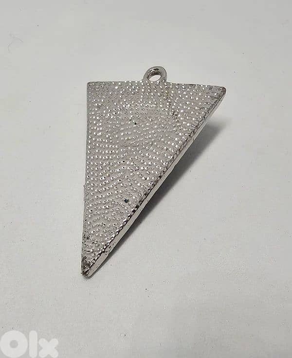 triangle-shaped pendant features a realistic blue eye 1