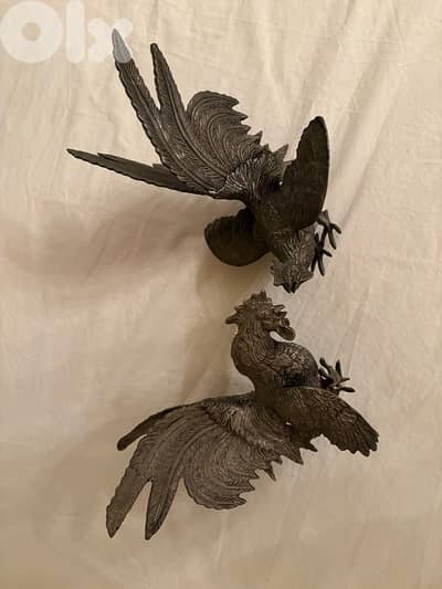 Paire de coqs en argenterie