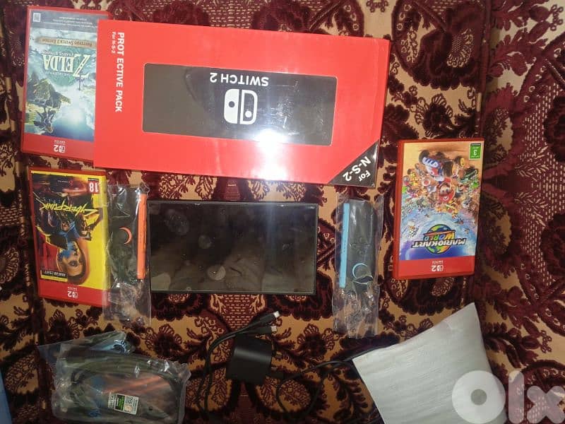 Nintendo switch 2 like new with 3 games screen protec 2