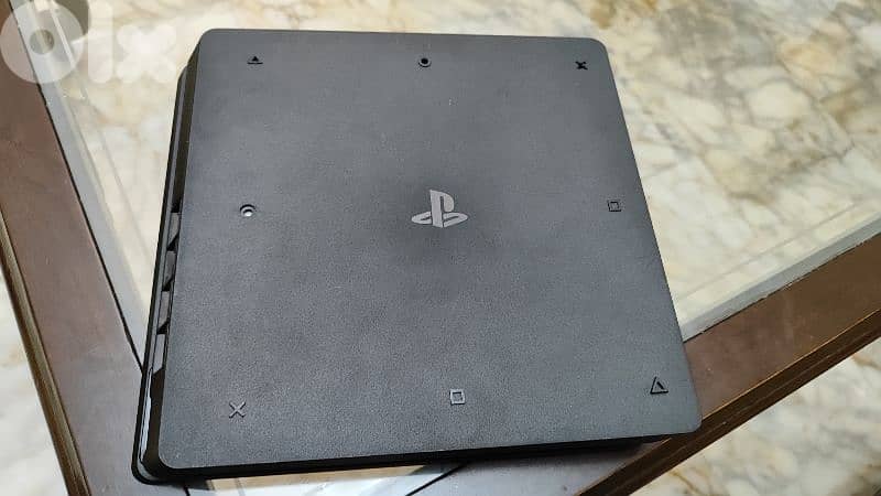 Used PS4 with 2 controllers and a bunch of cd games 1