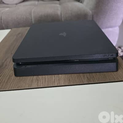 ps4 slim 1tb 4 controllers and 2 games