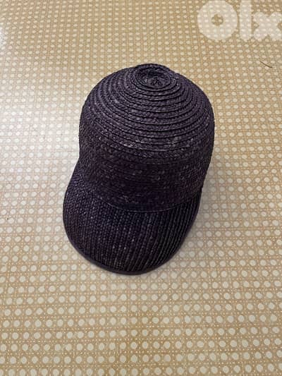 Black woven straw baseball-style woman’s cap