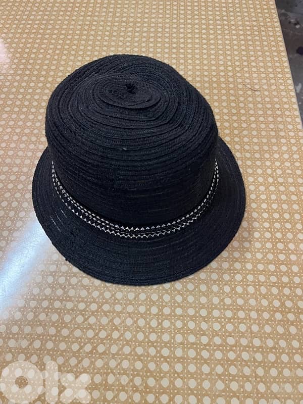 black braided cloche-style woman’s hat 1