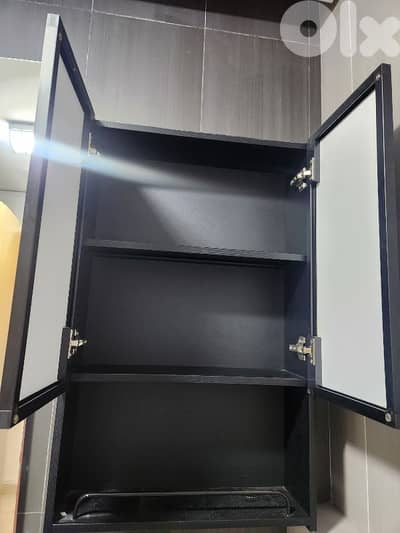 bathroom storage box with a black mirror door.