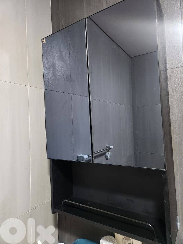 bathroom storage box with a black mirror door. 1