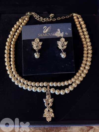 Swarovski faux pearl necklace and ear rings set.