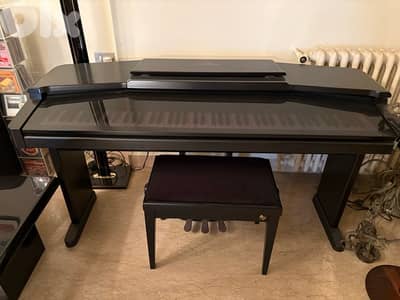 Piano Yamaha, modèle Clavinova en bois laqué