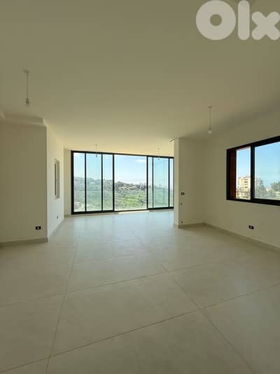 Sunny Apartment for Sale in Fanar with open sea view and terrace.