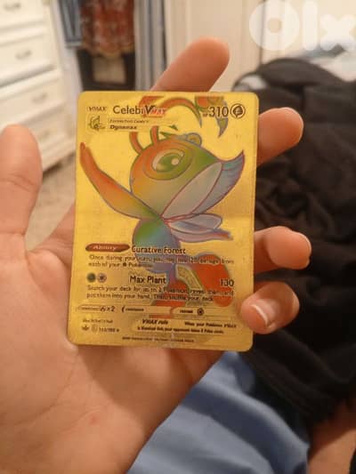 a gold metal card celebi
