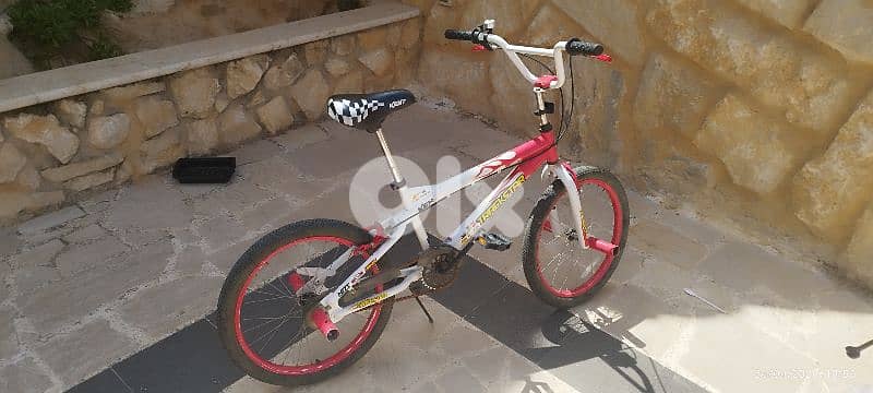 two bicycles and one stand for car 1