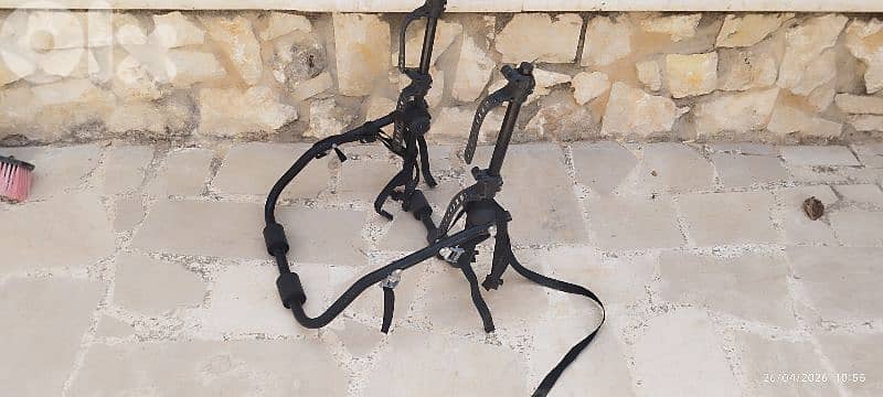 two bicycles and one stand for car 2