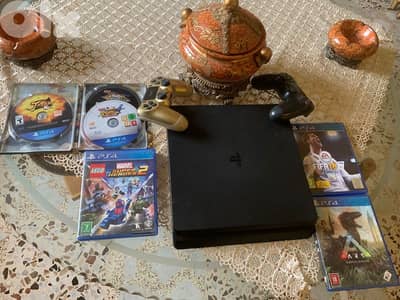 ps4 slim with 2 controller and 6 cds