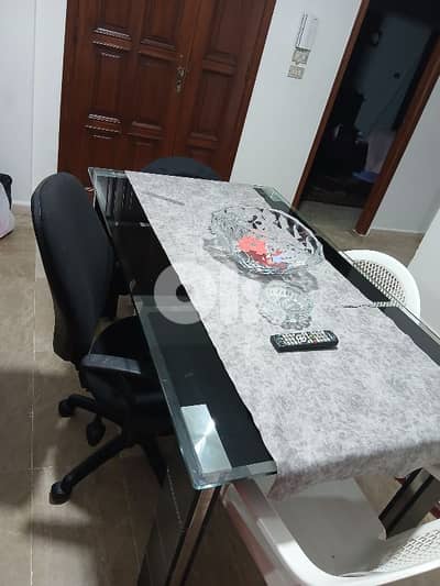 table without chairs and dresser