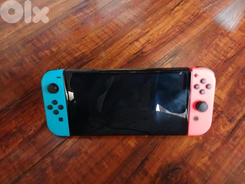 Nintendo switch oled with 3 video games plus all accessories 2