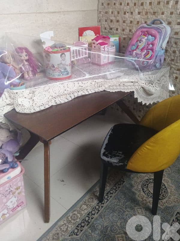 two beds with big dining table and 2 chairs 2