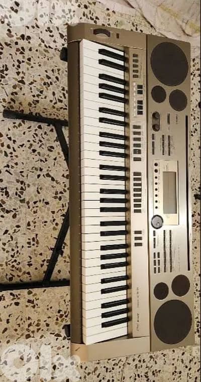 casio keyboard at3 تضيف مع ستاند و كرتونتو موجودة