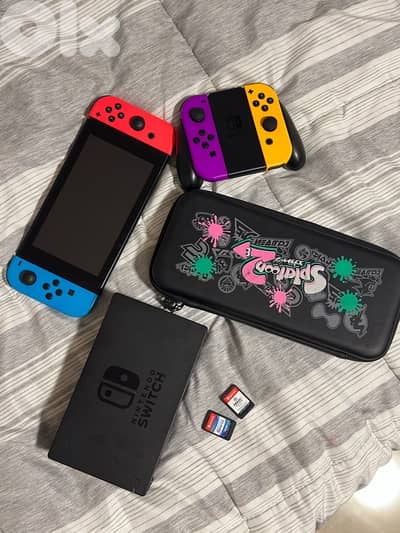 Nintendo Switch with 4 controllers, case, docking station and 2 games