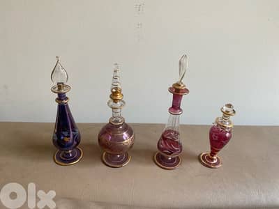 four miniature perfume bottles