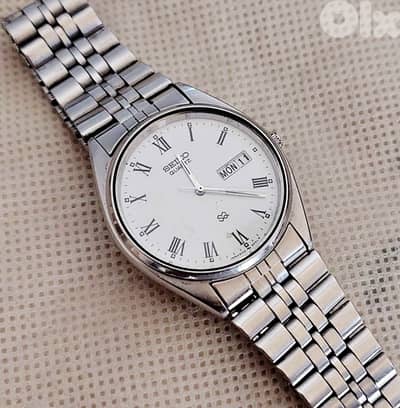Vintage Seiko SQ Quartz white Roman Dial Day-Date Watch