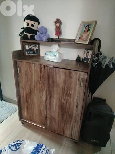 big shoe closet with shelf