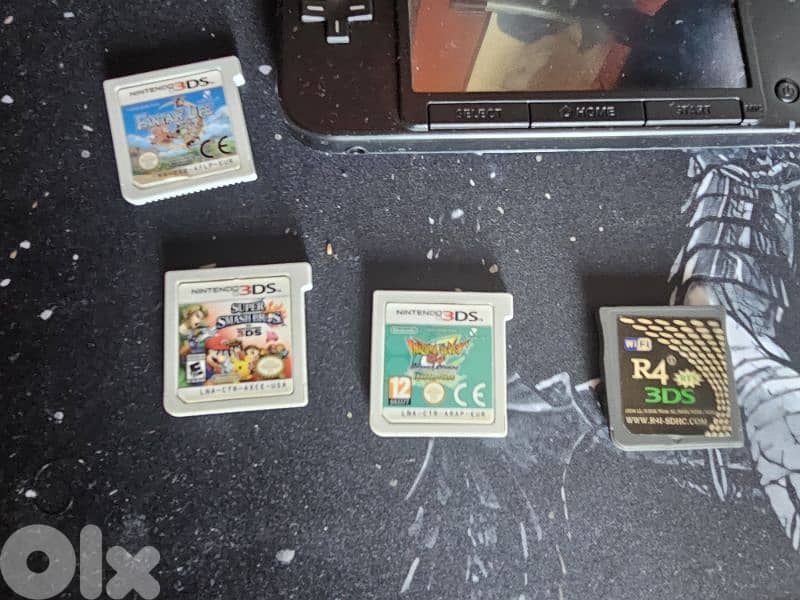 nintendo 3ds xl with games and sd cards 1
