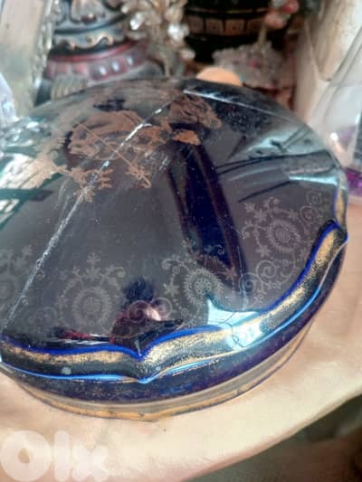 This is a vintage cobalt blue porcelain trinket box with gold floral a