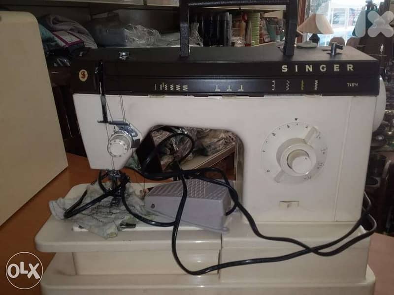 مكنة خياطة سنجر 0