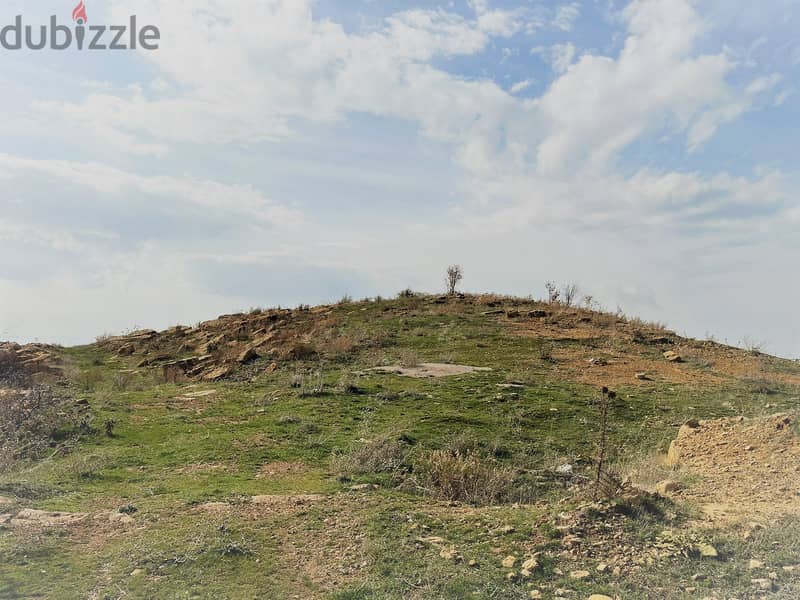 Prime Location LAND in Faqra with AMAZING Viewأرض في فقرا ٦١٠ م ٢ 1