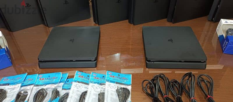 playstation 4 slim European with 2 controller all cable and 2 games 8