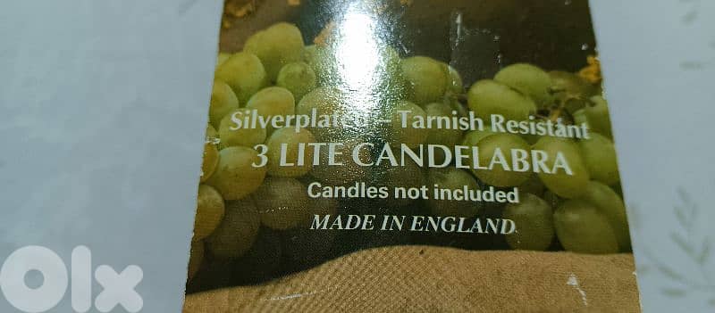 two 3 light silver plated candle holders. made in england 1